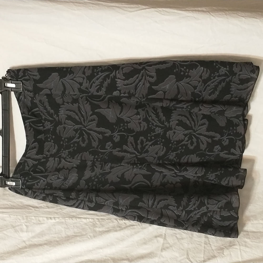H&M Black Skirt with floral print. Size 4.
